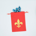 Flat red dice bag with fleur-de-lis motif 1